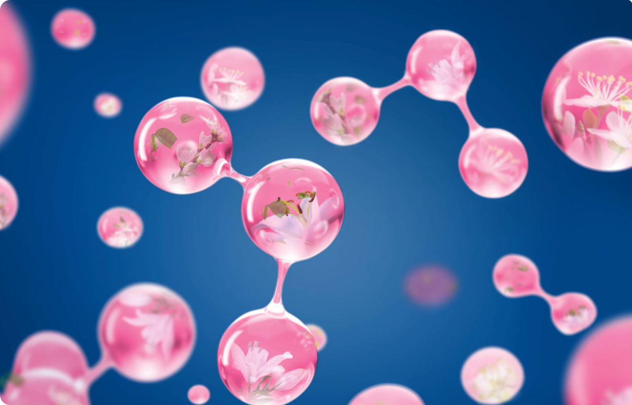 Pink 3D molecules against a blue background. Flowers grow inside the molecules.